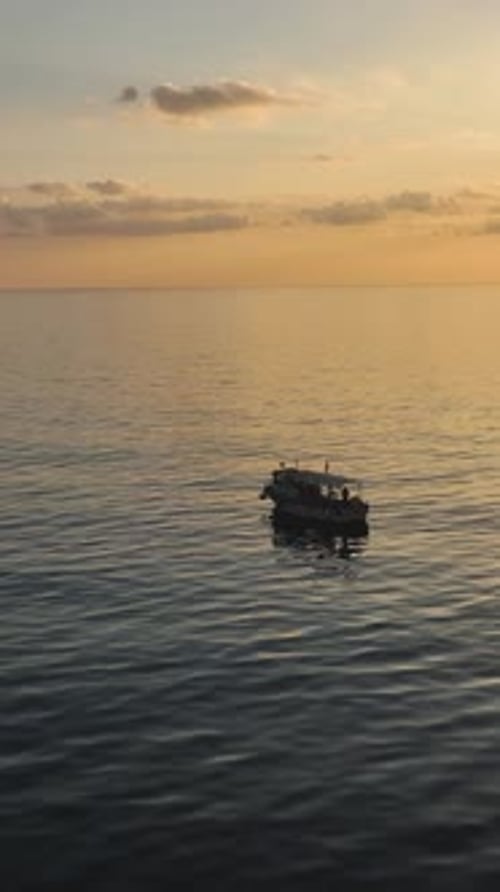 Vertical Video SkyHigh Adventure Fishing Boat Alanya Turkey Cinematic Sunset Fishing HighQuality