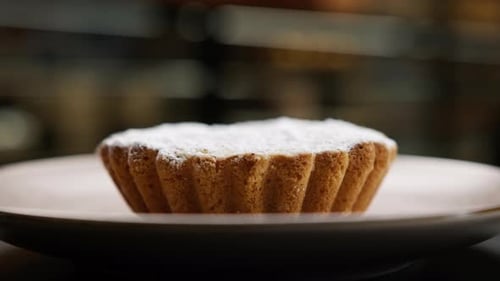 Close-up, bakery - delicious bun - cake on a rotating surface