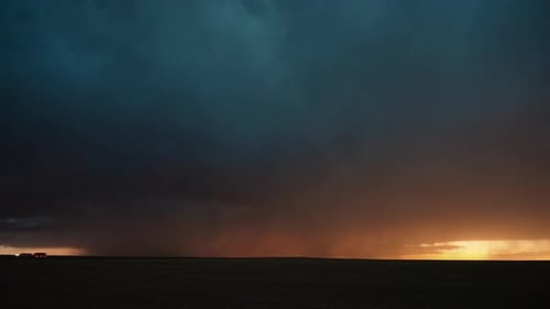 Dramatic Storm Clouds at Golden Hour on Horizon