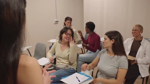 Women in Classroom Listening to Speaker