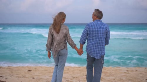 Romantic Middleaged Couple Enjoying a Peaceful Evening Together on the Beach Love Connection and