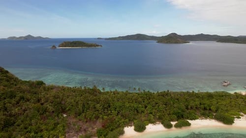 4K drone video of a beautiful tropical island in Palawan, Philippines. The drone is flying backwards