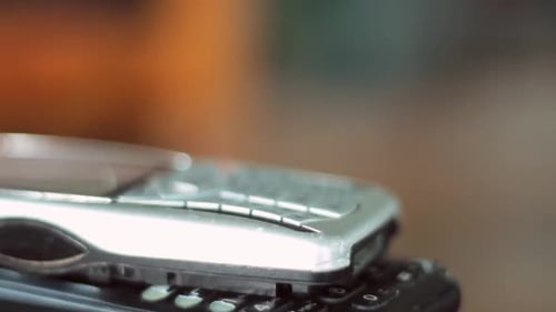 old mobile phones piled up on a table no people stock video stock footage