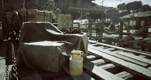 Rustic Setting Featuring a Milk Can and Wooden Crates in a Dusty Town