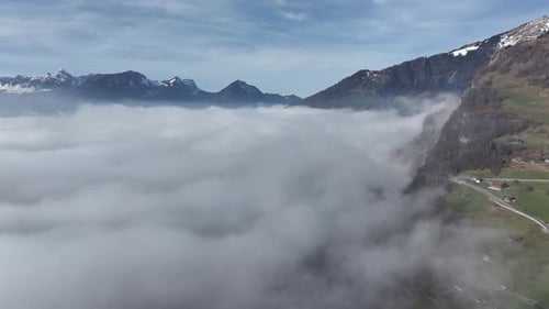Misty Walensee Alpine Vista from Amden. Swiss Alps aerial view