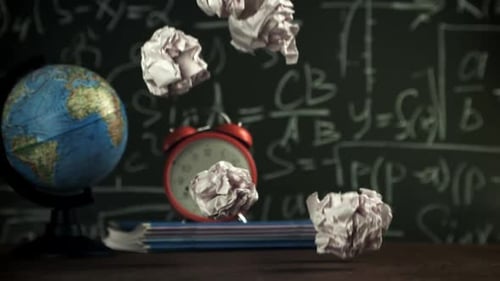 Crumpled Paper Falls on the School Desk Filmed on a Highspeed Camera at 1000 Fps