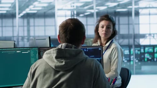 IT Employee and Coworker Talking While Building AI Diffusion Model App