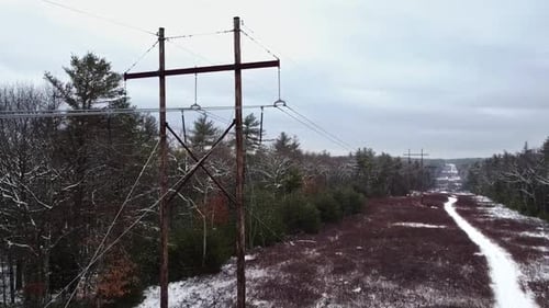 Ascending Aerial footage at an electrical power line corridor in eastern Massachusetts.