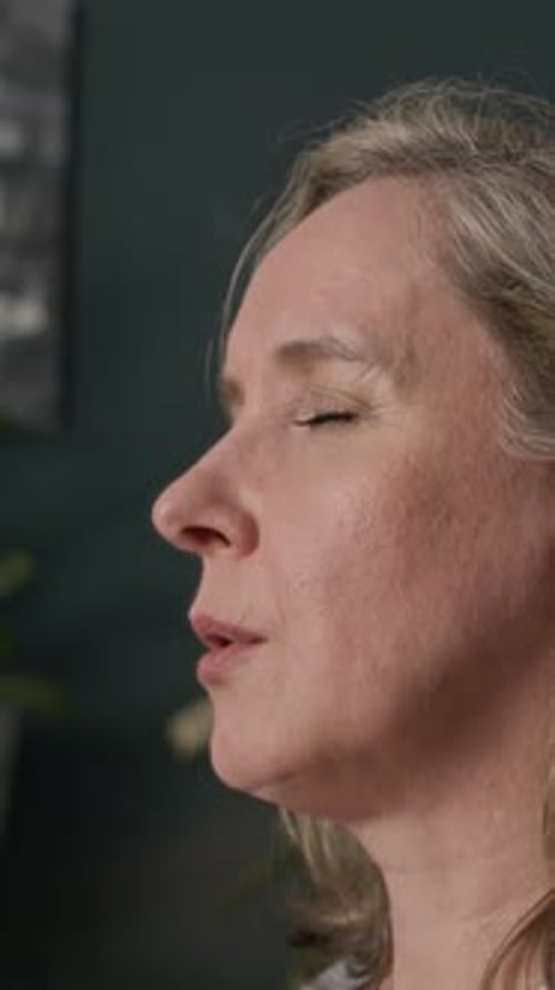 Woman Meditating Indoors with Eyes Closed Close Up