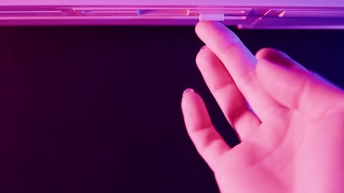 Hand Loads Floppy Disk Labeled Worm into Computer