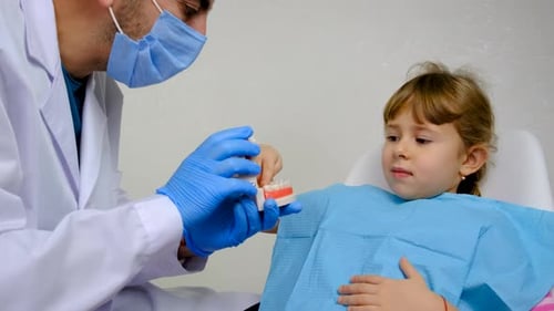 A Child at the Dentist Gets His Teeth Treated Selective Focus