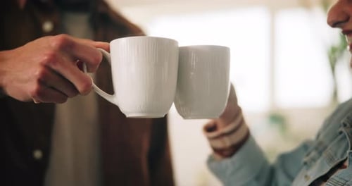 Friends Toasting Mugs Indoors
