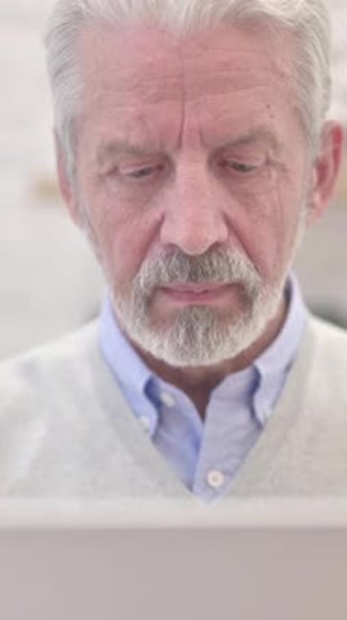 Close Up of Serious Old Man Looking at Camera, Vertical Video