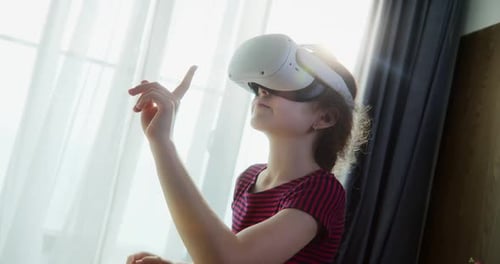Girl Using Virtual Reality Headset at Home
