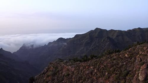 Drone footage of beautiful mountains. Arial shot during sunset above the clouds. Canary Islands, Ten