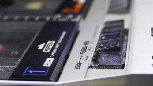 Finger Pressing Play on Vintage Cassette Deck