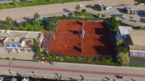 Aerial Video Luxurious White Yachts in a Port Next to a Tennis Club Captured From Above