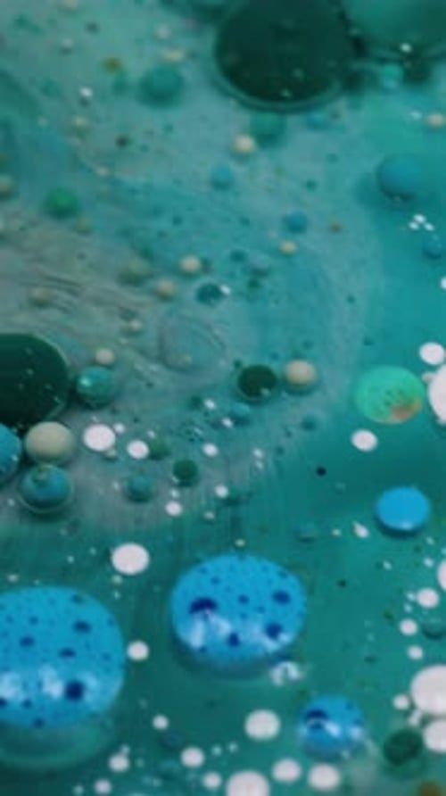 Abstract Liquids with Blue Base Forming Colorful Bubbles