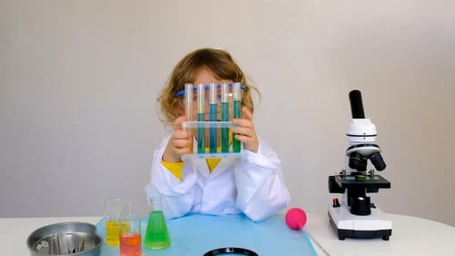Child Scientist with Test Tubes in Lab