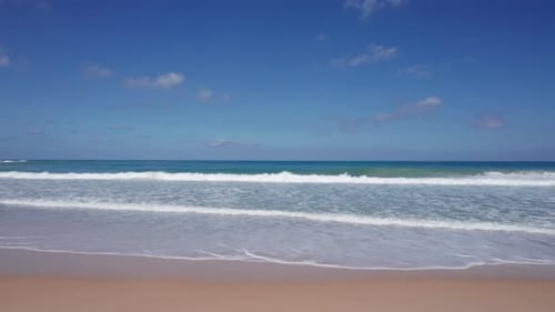Drone View of Big Ocean Waves and White Clouds