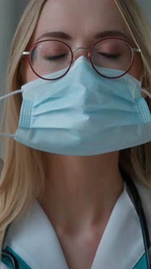Portrait Caucasian Doctor Woman Taking Off Face Protective Medical Mask Smiling Looking at Camera in