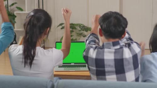 Happy Time Of Asian Teenagers Cheering And Watching Mock Up Laptop Green Screen And Celebrating