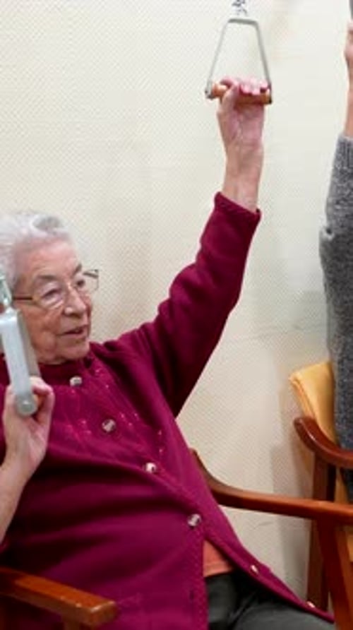 Elderly People Exercising Arms in Nursing Home