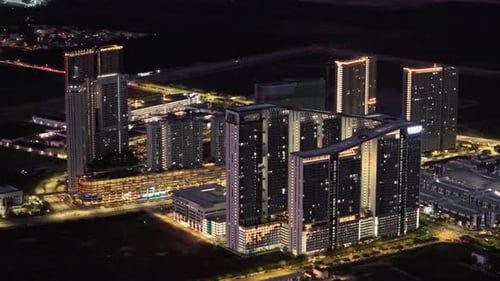A city skyline with a large building in the middle. Aerial night view Batu Kawan
