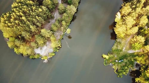 Aerial View of Small Island with Pine Trees in the Middle of the Lake