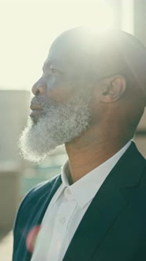 Serious, profile and African businessman in the city with leadership, corporate career and travel