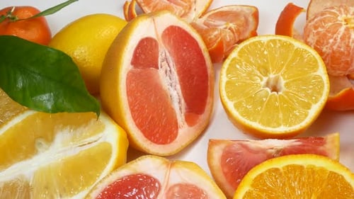 Colorful Citrus Fruits Sliced and Whole Close Up
