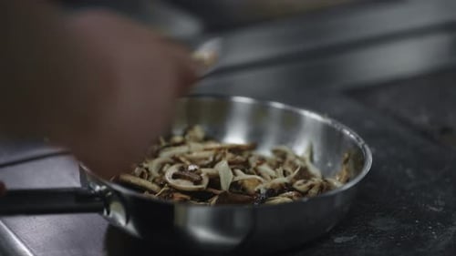 Cooking Mushroom Sauce Or Side Dish In Restaurant Kitchen Cook Shaking Frying Pan