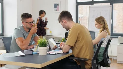 Business, People And Corporate Concept - Team Of Startuppers Or Ui Designers Working At Office