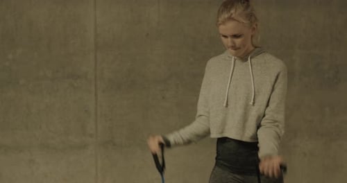 Woman working out using resistance band for exercise