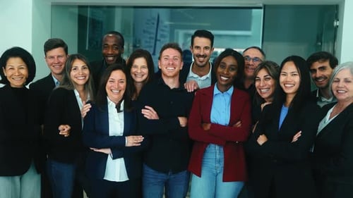 Diverse Team Smiling Together in Modern Workplace
