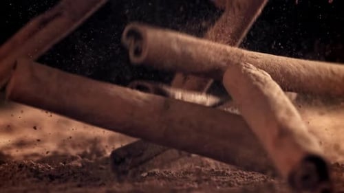 Cinnamon Sticks Fall on the Table Filmed on a Highspeed Camera at 1000 Fps