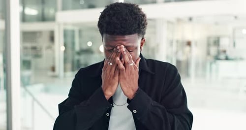 Stress, headache and black man in office with fatigue, burnout or anxiety for creative project