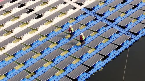 Aerial Top View of Renewable Energy Eco Technology Electric Power Industry Solar Panels on Floating