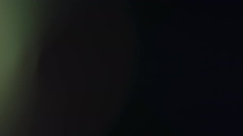 Abstract Overlay with Fast Moving Spot Lights Lens Flare Flashes Bright on Dark Background