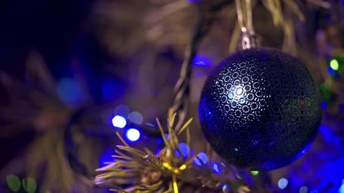 Festive Christmas Bauble on Christmas Tree at Night