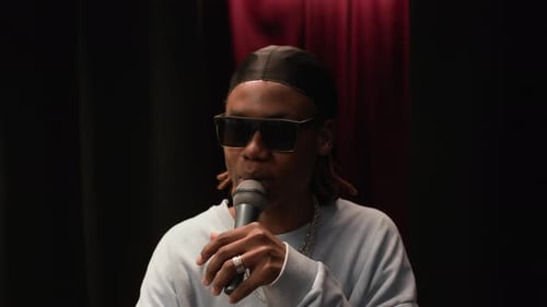 Gen Z African American Male Singer Performing Rap on Stage