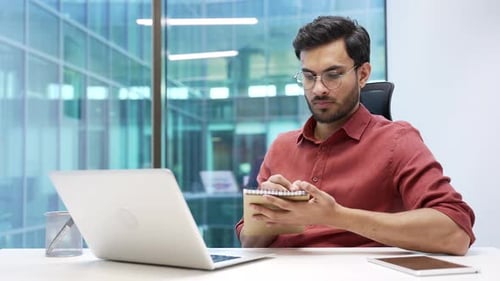 Man Works at Laptop in Bright Modern Office