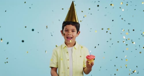 Happy birthday, child and smile with confetti in party with cupcake, hat