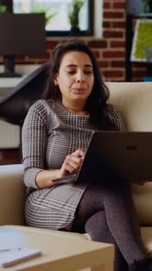 Vertical Video Woman Greeting Remote Working Coworkers During Videocall