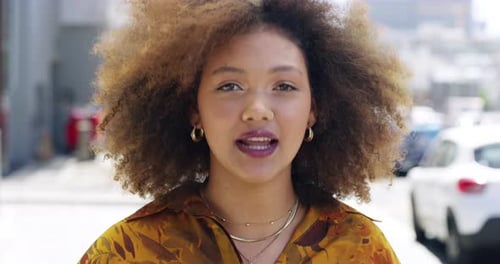4k video footage of a young woman being interviewed about her internet speed on the street