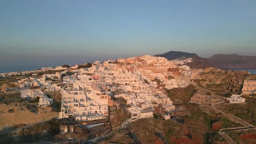 Picturesque Hillside Town near Ocean during Golden Hour
