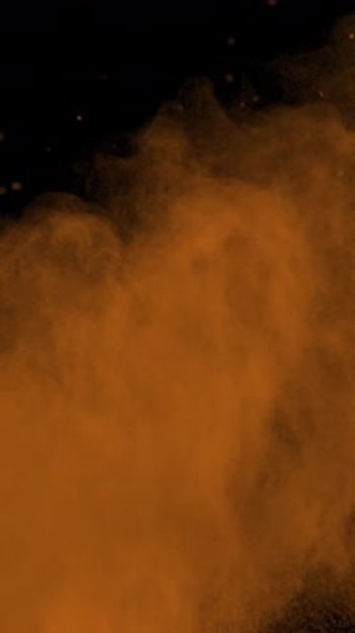 Super Slow Motion Shot of Orange Color Powder Explosion at 1000Fps Vertical View