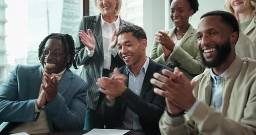 Smiling Professionals Applaud in Modern Office