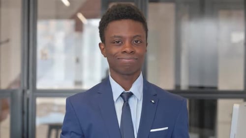 Portrait of Rejecting African Businessman Showing Dislike