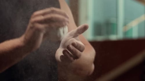 Athletic Handsome Male Sportsman Working in the Gym Using Talcum Powder Strong and Healthy